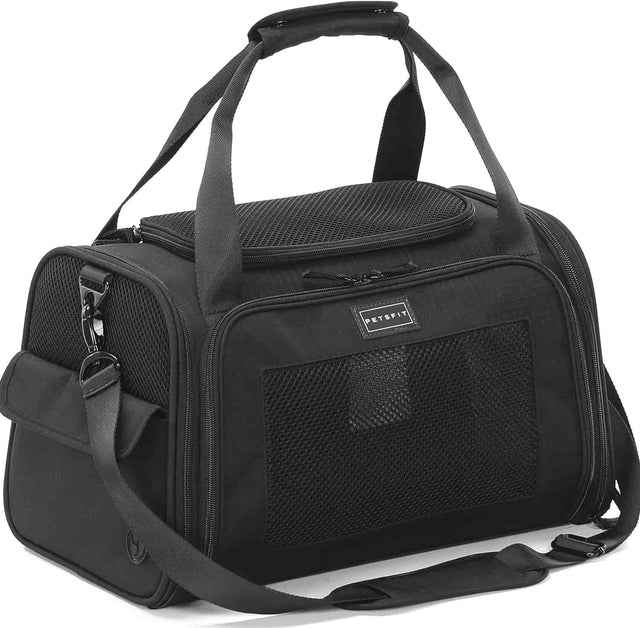 Black soft-sided pet carrier with mesh windows, dual handles, shoulder strap, and zippered openings on three sides.