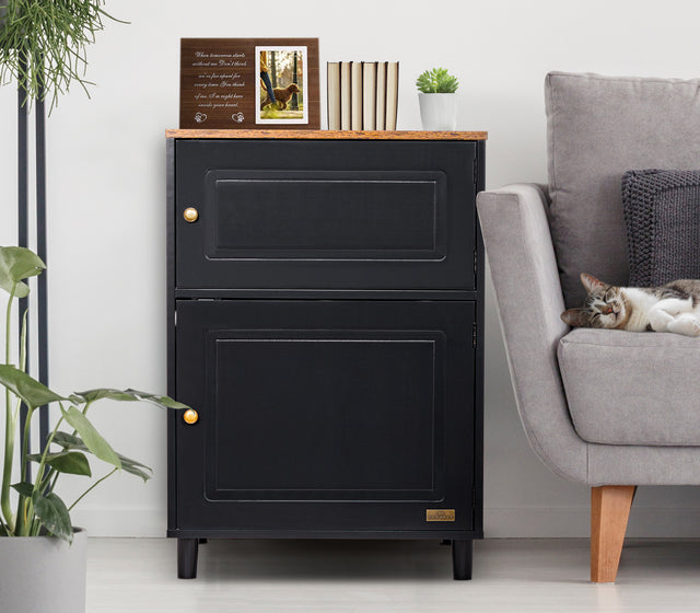 Black Petsfit litter box cabinet serving as a stylish side table with plants and books, blending seamlessly with home decor