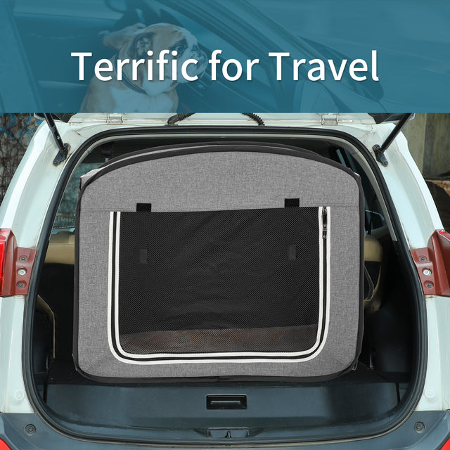 Rear cargo view of a gray collapsible dog crate positioned in an open SUV trunk, highlighting easy travel-ready fit.