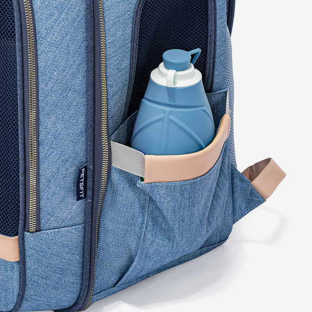 Close-up of side pocket holding a water bottle, with elastic support strap for secure storage during outings.