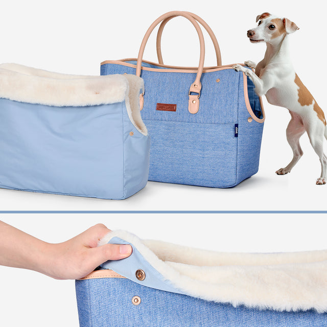 Pet owner carrying PETSFIT denim pet tote outdoors with small dog inside