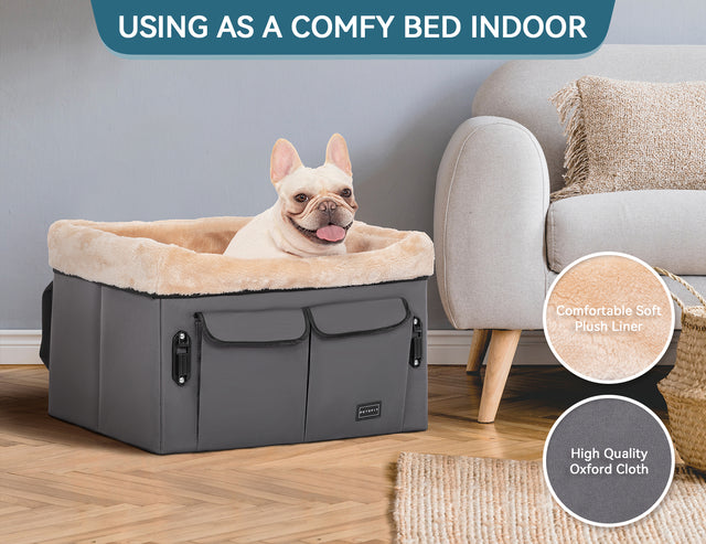 Indoors beside a sofa, the dog booster seat doubles as a cozy pet bed with soft plush lining and sturdy fabric sides.