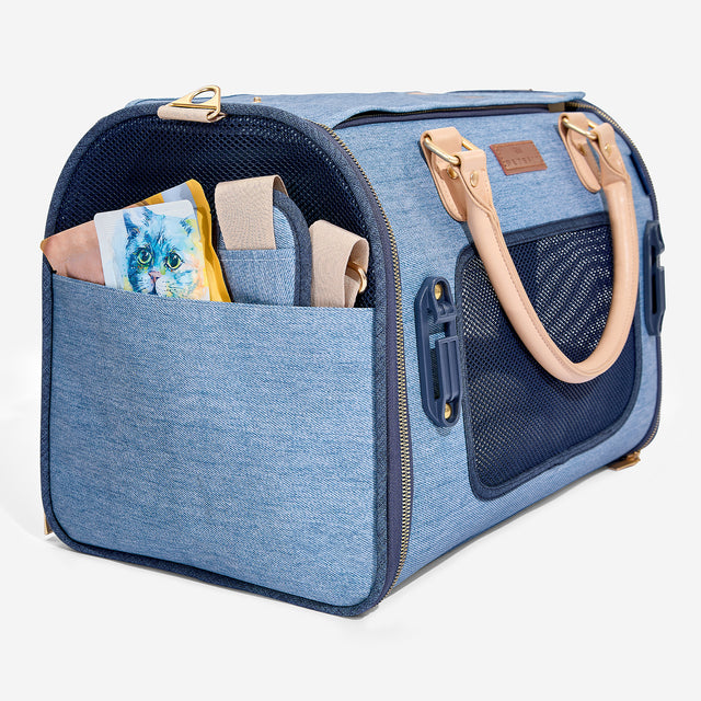 Front storage pocket and side compartments on Petsfit denim backpack for carrying pet supplies and personal items