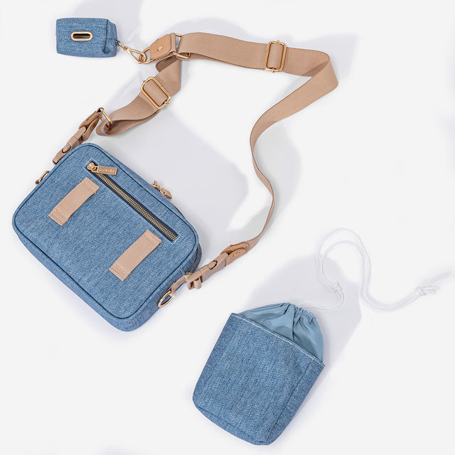 PETSFIT Vira Blazer denim crossbody bag feature diagram showing adjustable strap, multiple pockets, poop bag dispenser and treat compartment