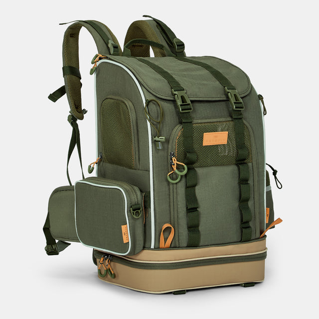 Pet backpack in olive green with mesh panels, side pouch, buckle straps, and a reinforced base.