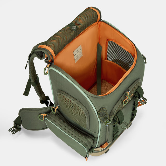 Pet backpack opened at the top, showing orange lining, safety leash, mesh window, and cushioned floor.