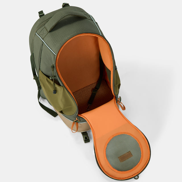 Pet backpack fully unzipped, showing orange lining, a mesh front door, tether strap, and soft floor pad.