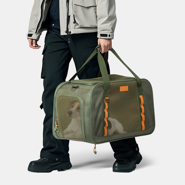 Front view of PETSFIT WildPath Pet Travel Carrier in military green with orange interior