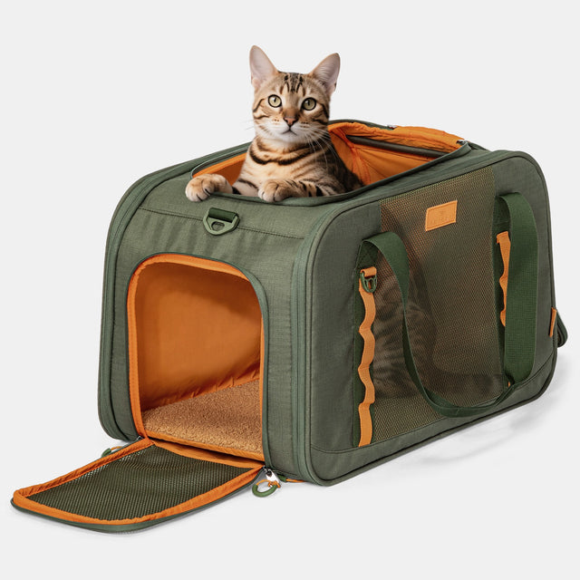 PETSFIT WILDPATH olive green pet travel carrier with tabby cat peeking out from open top zippered entry, front mesh window and side mesh panel visible on white background