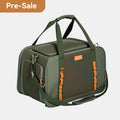 PETSFIT WILDPATH olive green pet travel carrier side angle view showing dual top handles, orange accent straps, mesh side panel and shoulder strap, Pre-Sale badge