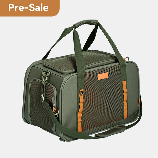 PETSFIT WILDPATH olive green pet travel carrier side angle view showing dual top handles, orange accent straps, mesh side panel and shoulder strap, Pre-Sale badge