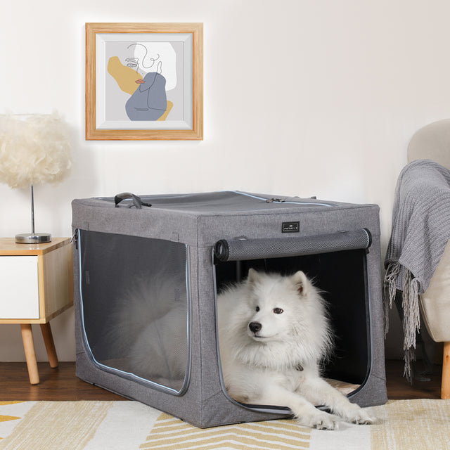 A golden retriever sleeping comfortably in a cozy gray Petsfit soft dog crate