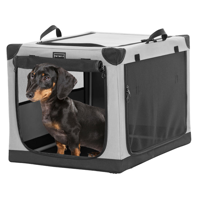 Black and tan dachshund stands inside a gray soft dog crate with front door open and breathable mesh side panels.