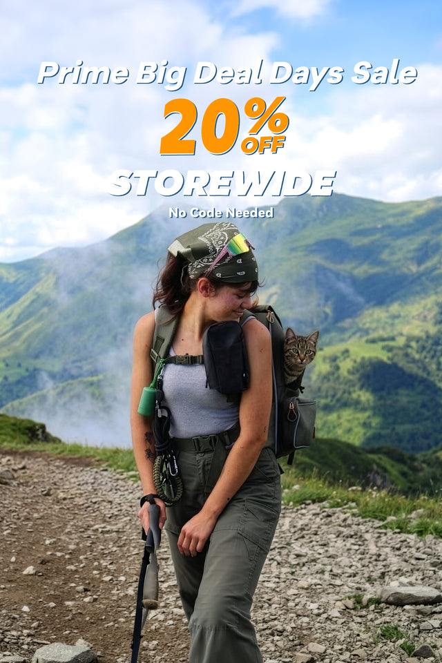 Prime Big Deal Days 20% off banner: hiker on a green mountain ridge with a tabby cat riding in an olive pet backpack (mobile version)