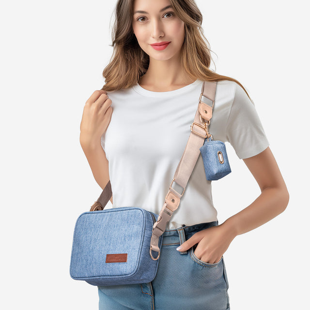 PETSFIT denim dog walking bag open showing internal compartments with treat storage, phone pocket, key clip and waste bag roll holder