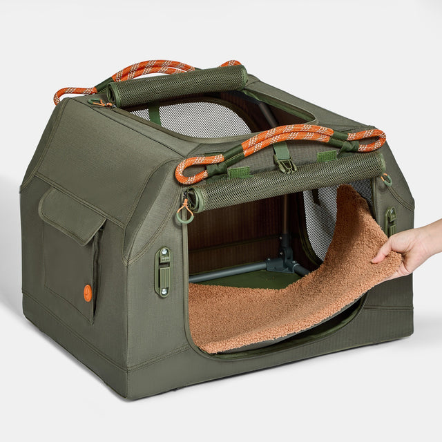 PETSFIT WILDPATH angled soft travel dog crate loaded into car trunk showing perfect fit against sloped trunk lid with dog resting comfortably inside