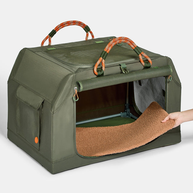 PETSFIT WILDPATH soft travel dog crate with front roll-up door open showing removable brown fleece mat being pulled out, full interior view with side storage pocket