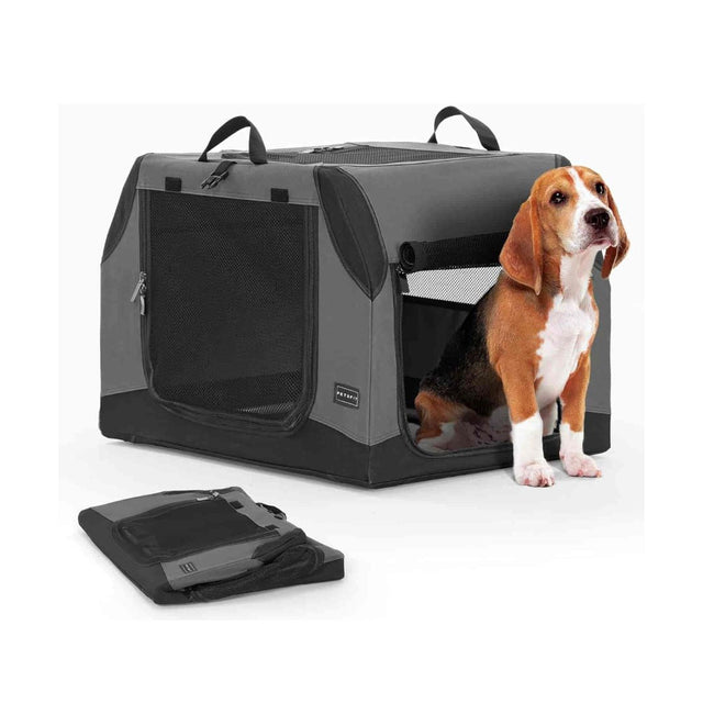 Beagle sits at the open side door of a gray travel dog crate with mesh ventilation, plus a folded carry-flat kennel nearby.